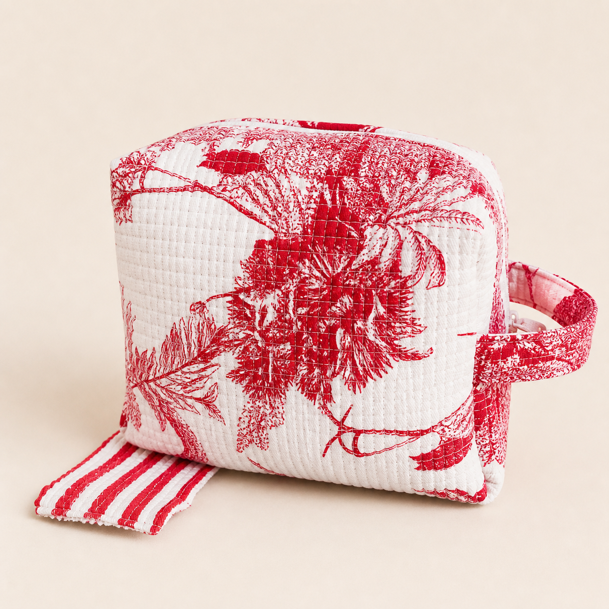 The Quilted Jacket Pouch in red and white quilted cotton on a clean studio background.